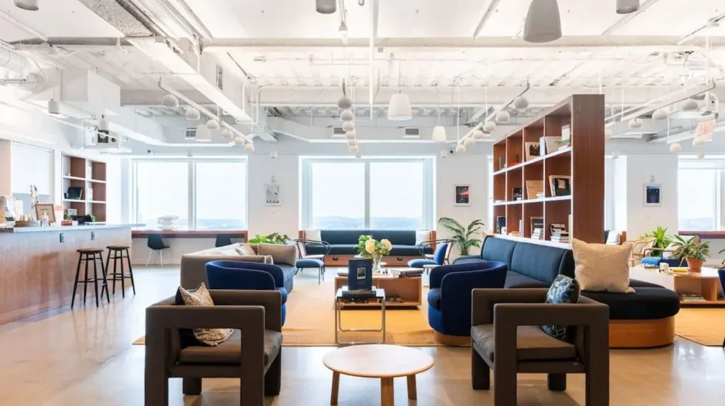 WeWork Boston, a contemporary coworking space with ergonomic seating and vibrant atmosphere.