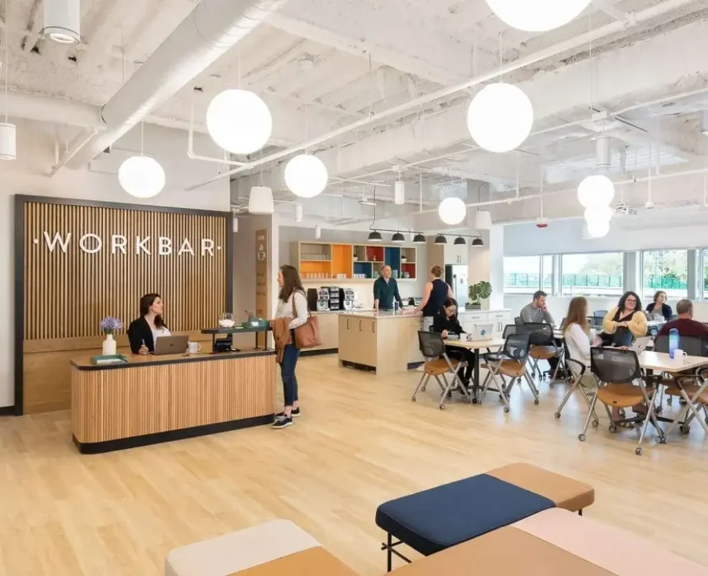 Workbar Boston, a cozy coworking space with ergonomic furniture and ample natural light.