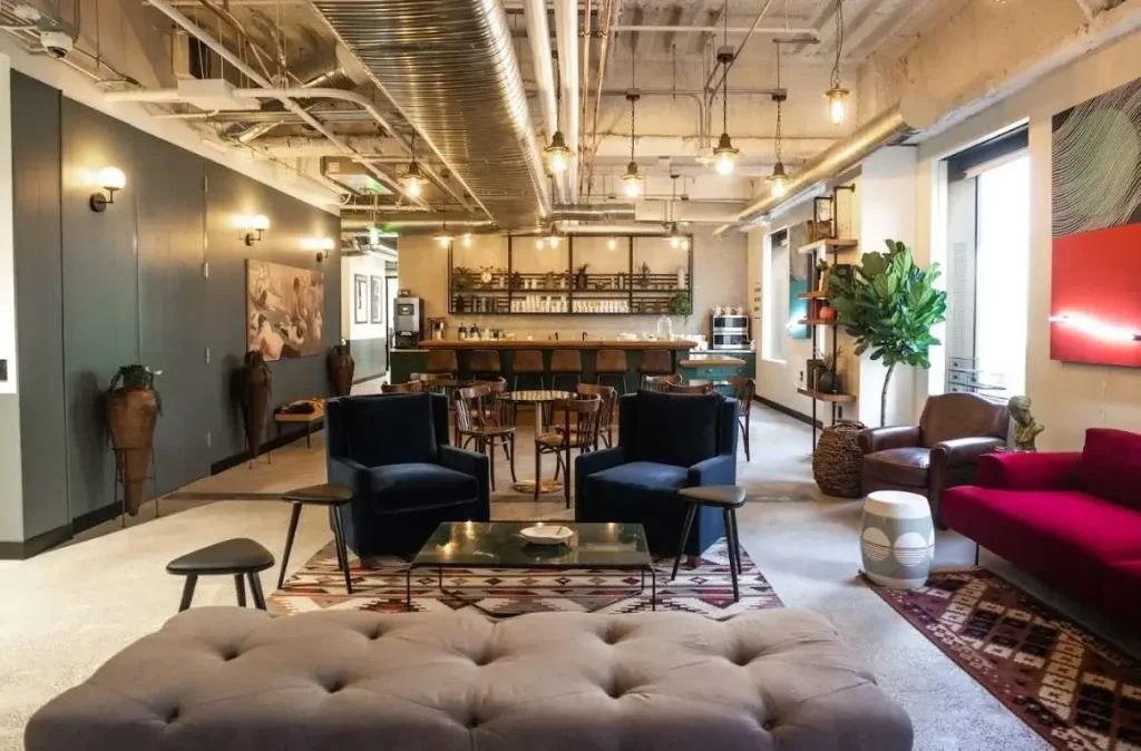 MindSpace coworking interior with artistic decor, leather couches, and coffee bar.